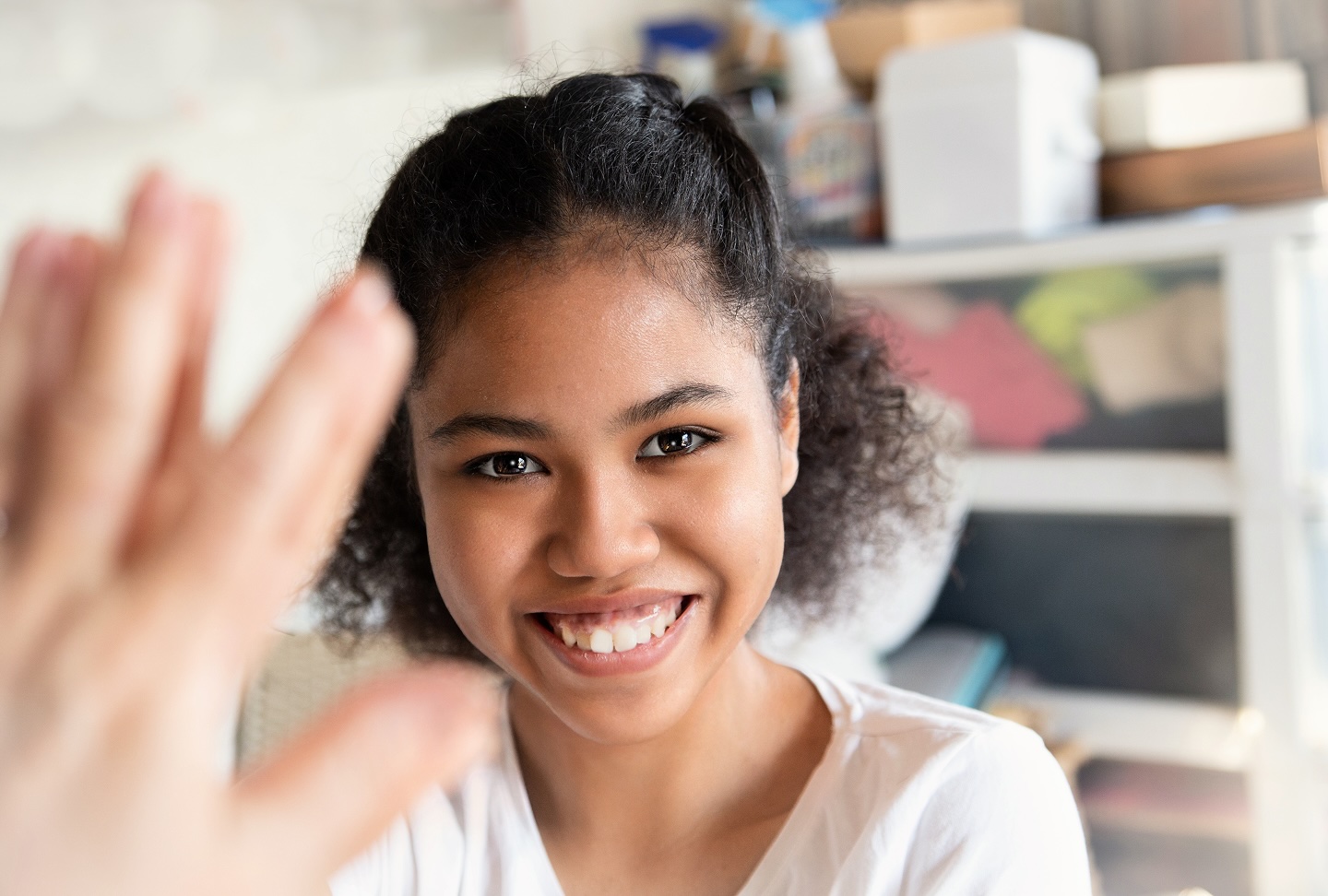 Smiling woman waving