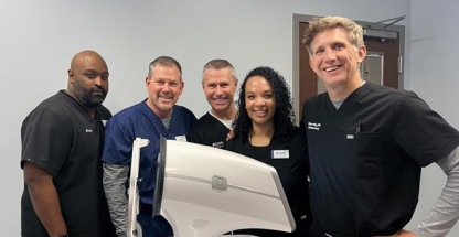 Group of smiling people at alcon product