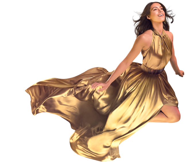 Woman floating through the air in a gold dress