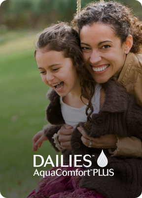 Woman hugging child smiling