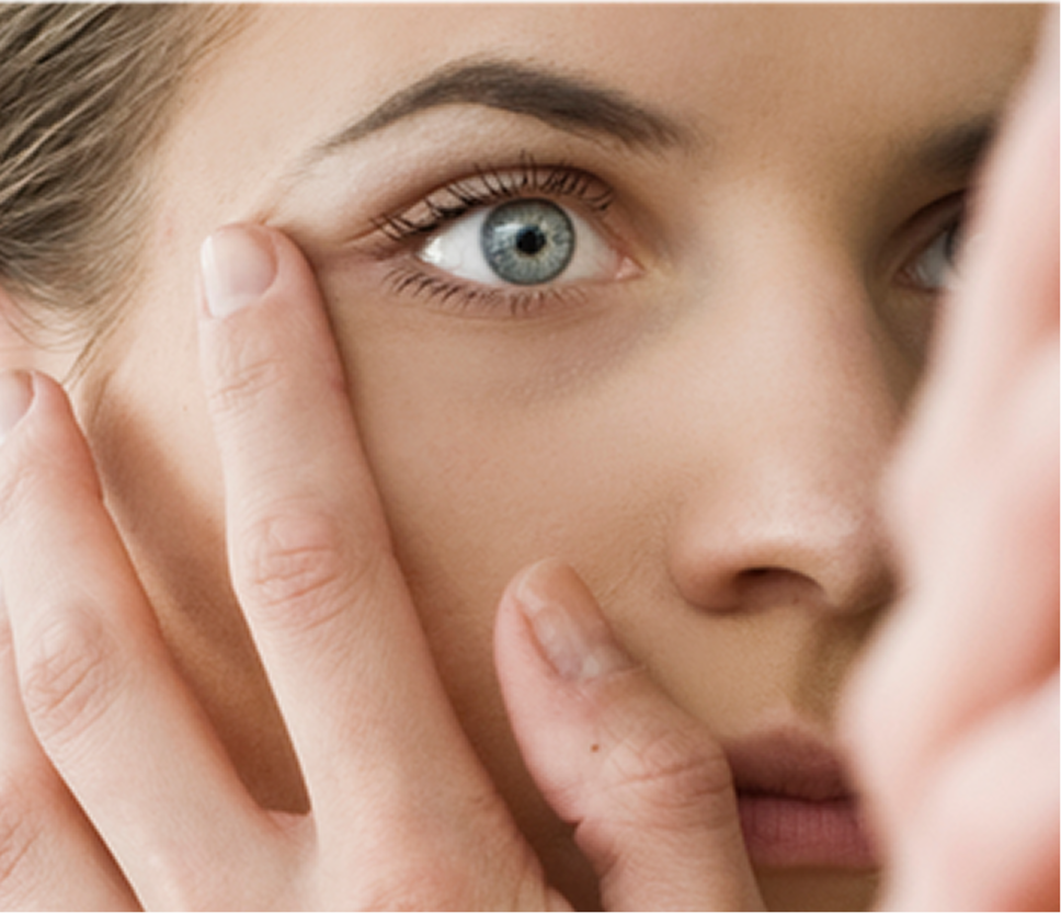 woman checking her eye