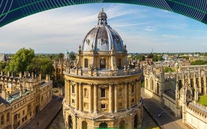A historic domed building surrounded by stone buildings, viewed from above