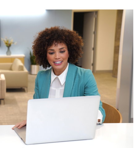 Woman in office with laptop